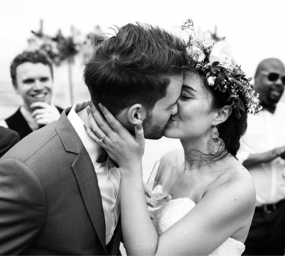 Couple kissing in a romantic wedding setting